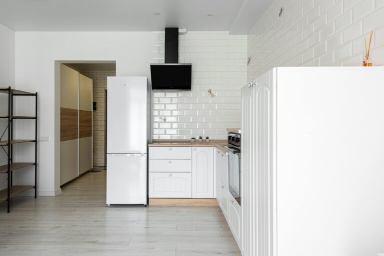 Modern white kitchen illustrating chemical-free sanitization and improved indoor air quality in educational or childcare environments.