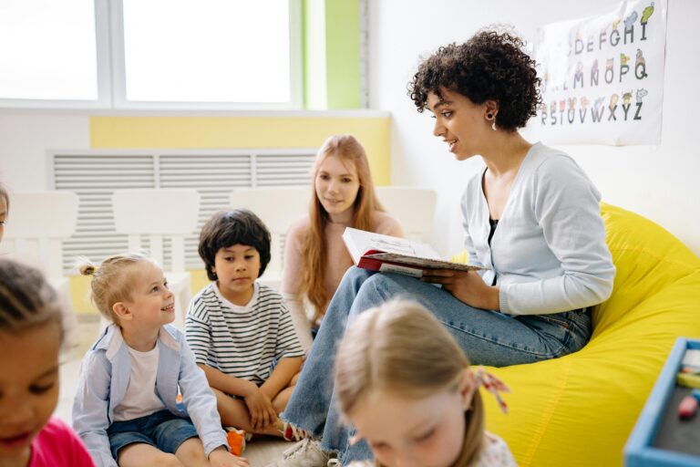Teacher leading a storytime session with young children in a bright classroom—emphasizing Healthy Tools for early learning environments.