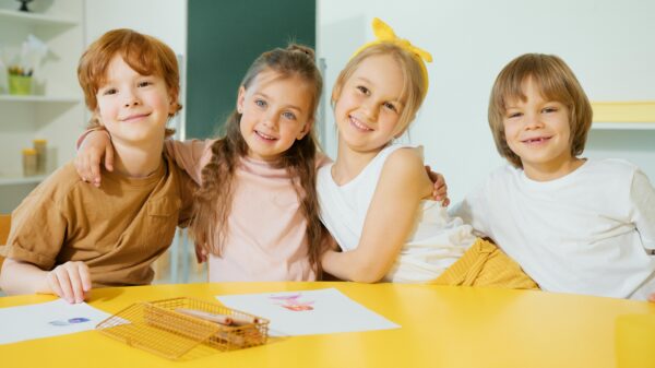 Children’s classroom with happy kids learning together in a healthy, safe environment.
